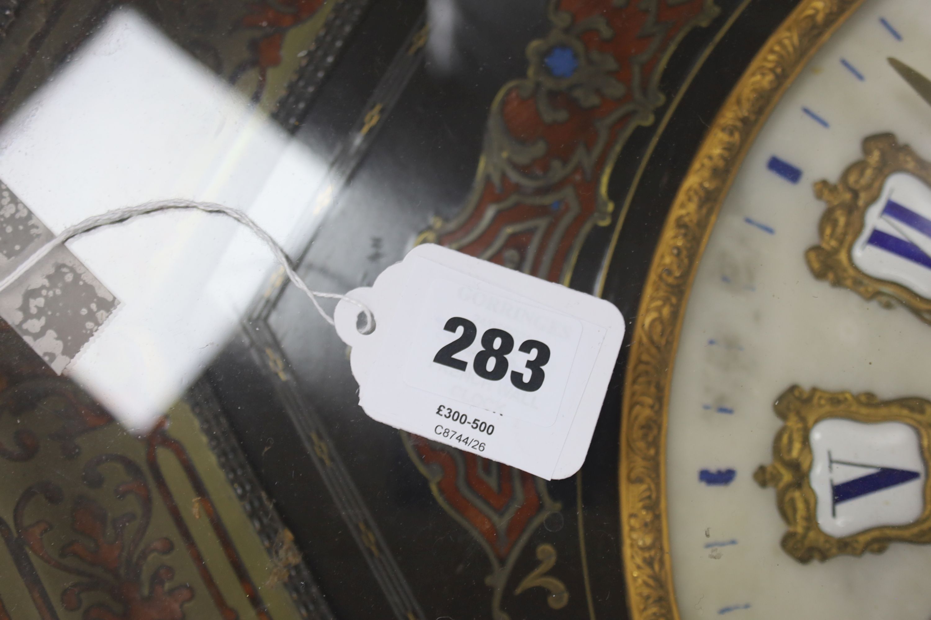 A 19th century French ebonised boulle wall clock, width 68cm length 66cm